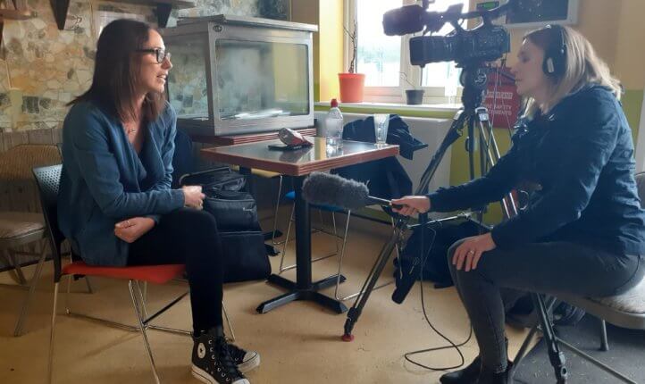 ITV Anglia reporter Victoria Lampard interviews All In team member Rebecca